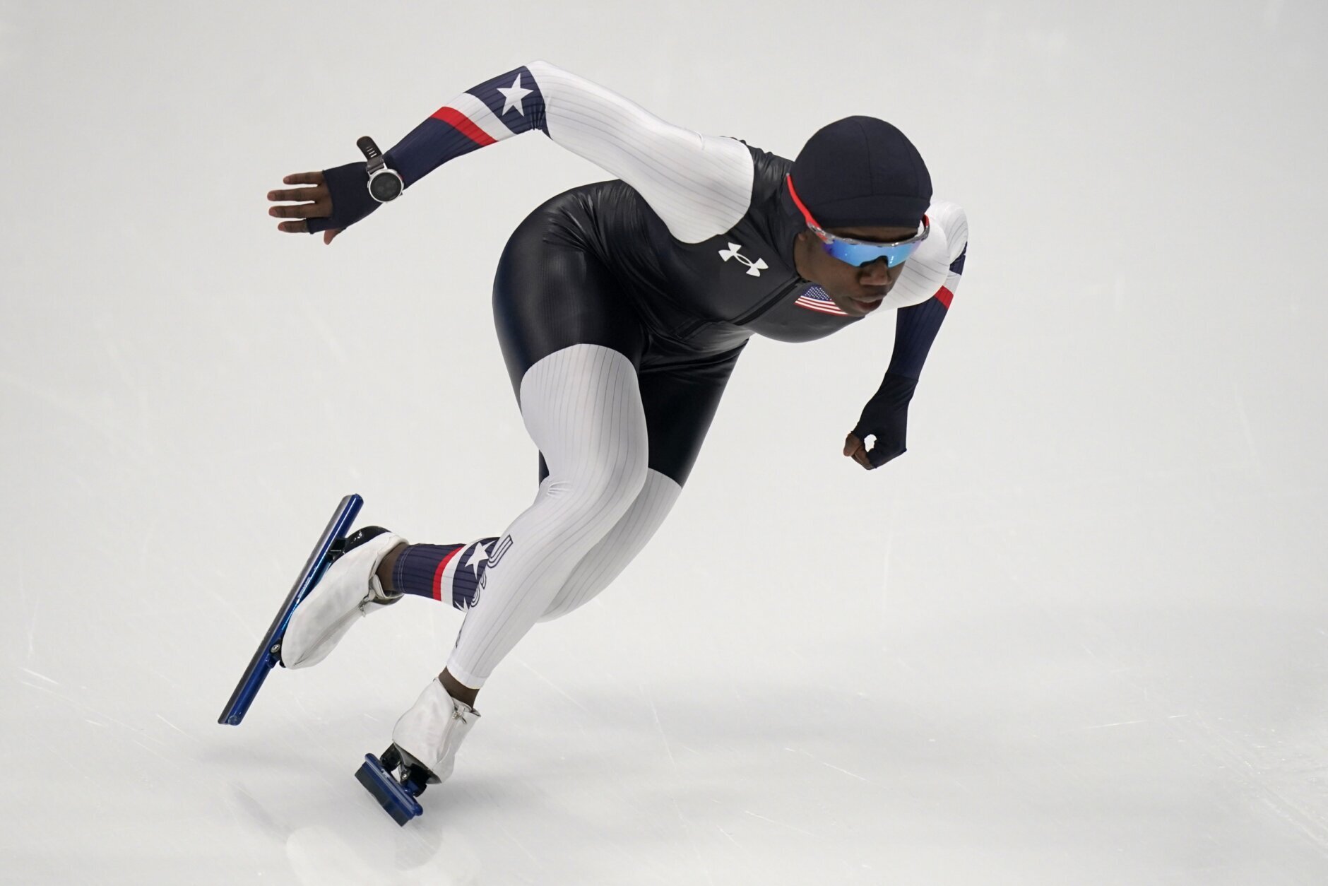 FILE- Erin Jackson of the United States skates during a speedskating practice session at the 2022 Winter Olympics, Wednesday, Feb. 9, 2022, in Beijing. Jackson became the first Black woman to win a gold medal in speedskating. In other events, a small number of Black and Hispanic athletes compete with longshot chances at medals.(AP Photo/Gerald Herbert, File)