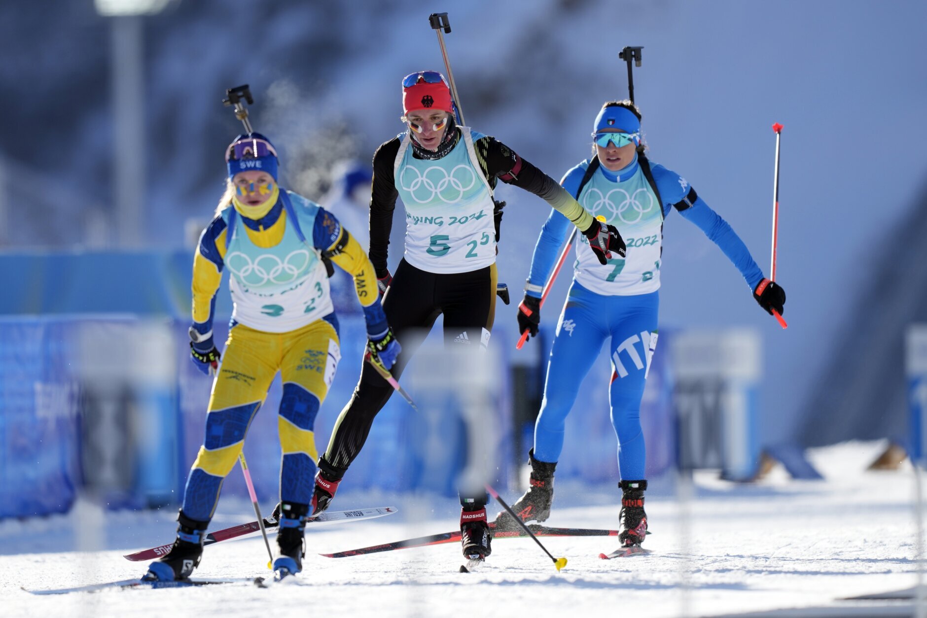 <p>Mona Brorsson of Sweden, left, Vanessa Hinz of Germany and Dorothea Wierer of Italy ski onto the shooting range during the women&#8217;s 4&#215;6-kilometer relay at the 2022 Winter Olympics, Wednesday, Feb. 16, 2022, in Zhangjiakou, China.</p>
