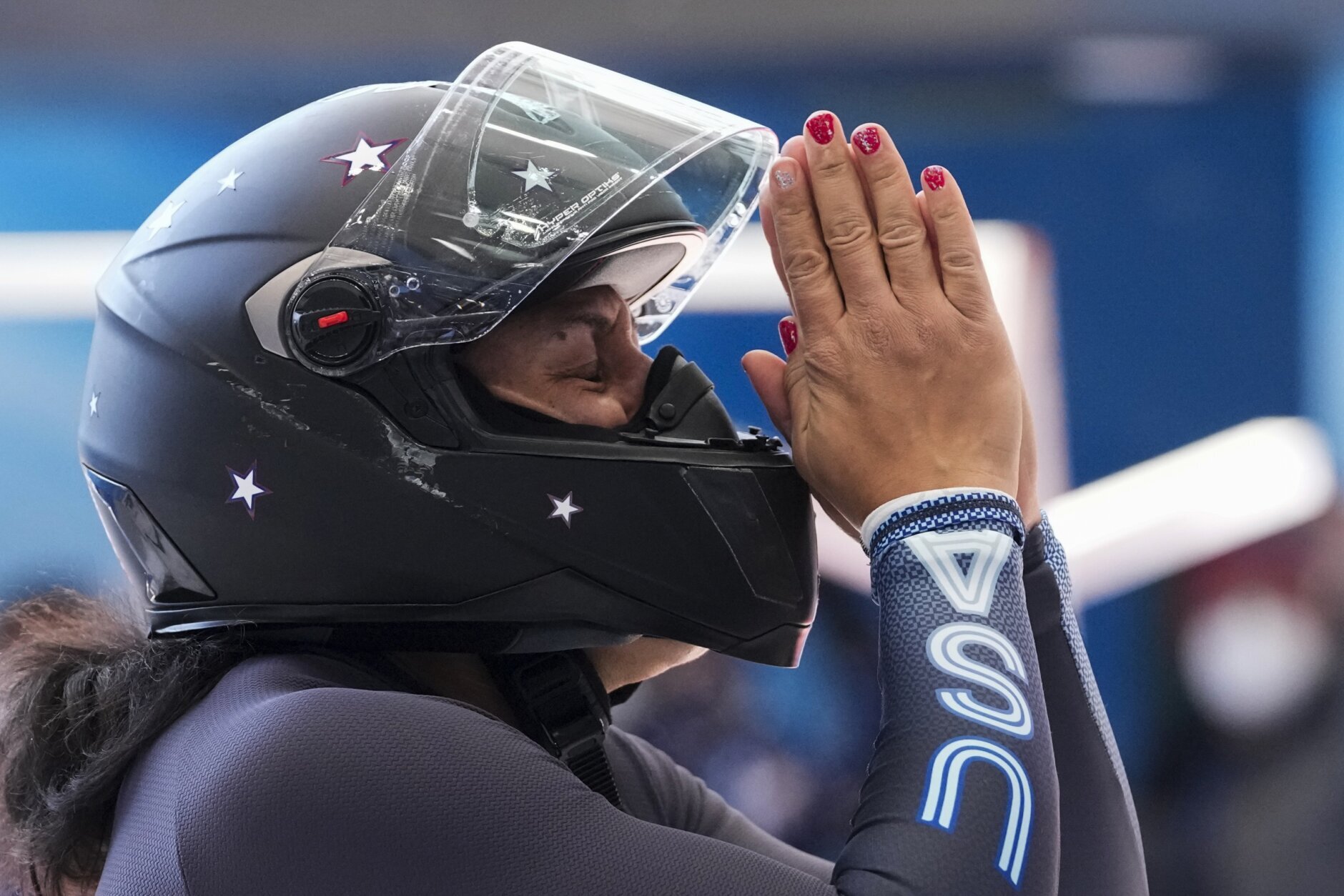 <p>Elana Meyers Taylor, of the United States, celebrates after her women&#8217;s monobob heat 4 at the 2022 Winter Olympics, Monday, Feb. 14, 2022, in the Yanqing district of Beijing.</p>
