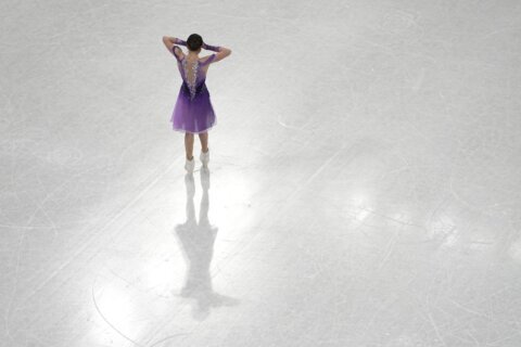 AP PHOTOS: Valieva skates, Su wins on Day 11 at Olympics