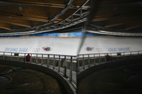 AP PHOTOS: A Day 3 filled with crashes at Beijing Olympics