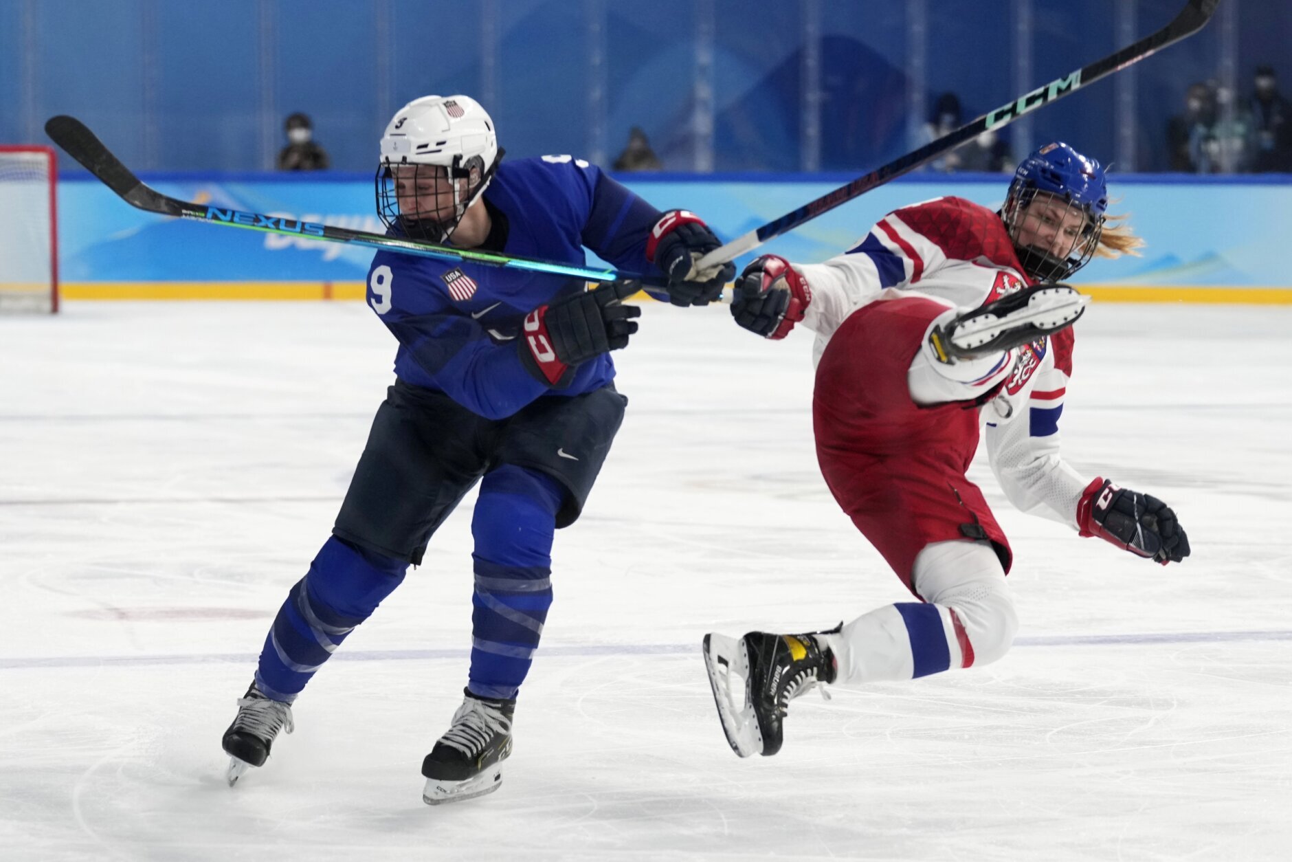 <p>Czech Republic&#8217;s Daniela Pejsova, right, falls next to United States&#8217; Megan Bozek (9) during a women&#8217;s quarterfinal hockey game at the 2022 Winter Olympics, Friday, Feb. 11, 2022, in Beijing.</p>
