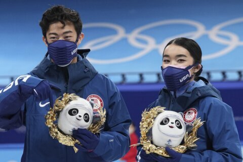 AP sources: US skaters to get Olympic torches as medals wait