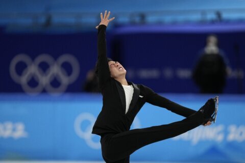 Chen delivers record short program to begin Olympic pursuit
