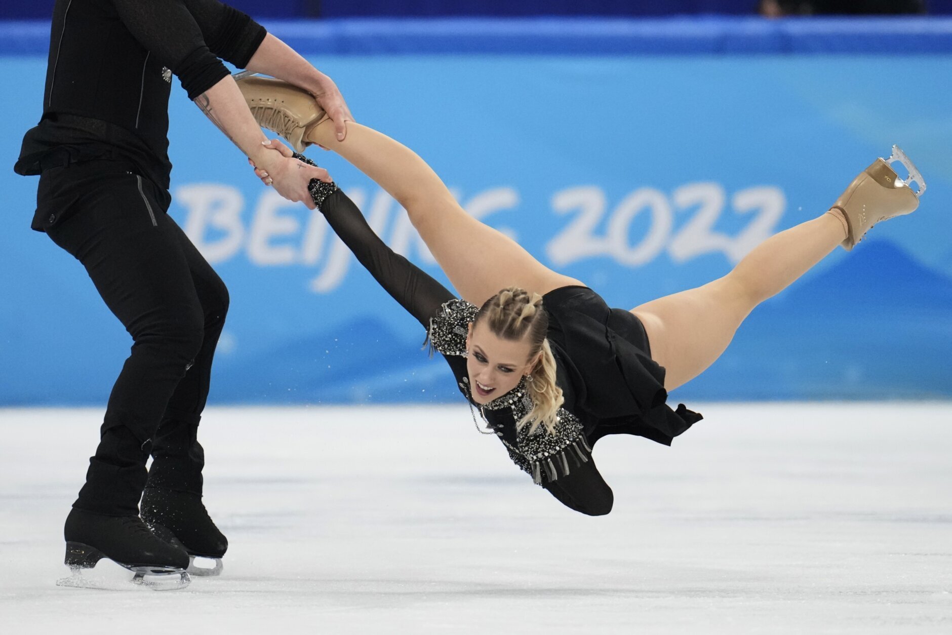 <p>Madison Hubbell and Zachary Donohue, of the United States, perform their routine in the ice dance competition during figure skating at the 2022 Winter Olympics, Saturday, Feb. 12, 2022, in Beijing.</p>
