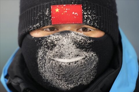 AP PHOTOS: Olympic frost hangs in hair, masks and lashes