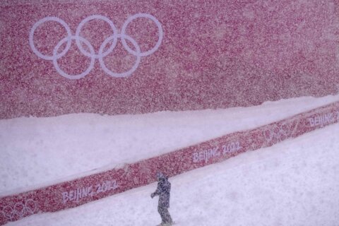 Skiers struggle as real snow falls on Winter Olympics