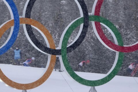 AP PHOTOS: Snow delights — and disrupts — Beijing Olympics