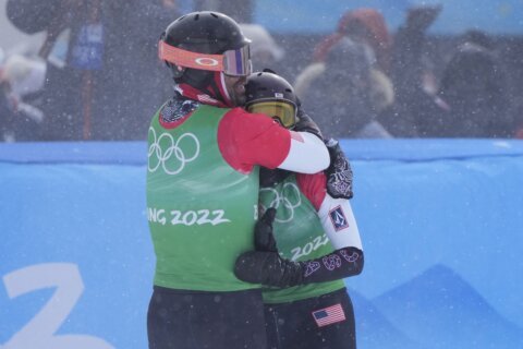 Longtime US teammates win mixed snowboardcross at Olympics