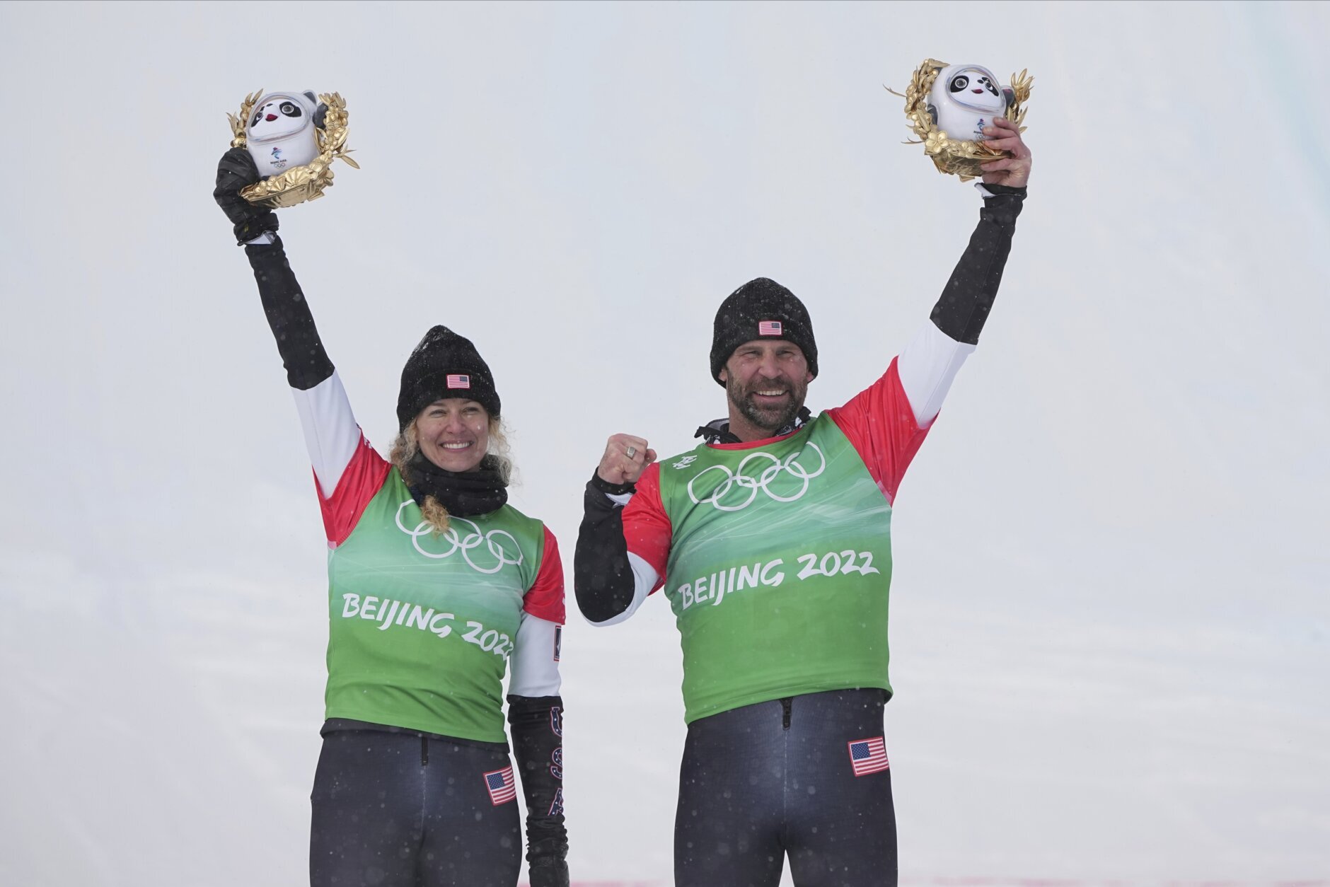 <p>Gold medal winners United States&#8217; Lindsey Jacobellis and Nick Baumgartner celebrate during the venue award ceremony for the mixed team snowboard cross finals at the 2022 Winter Olympics, Saturday, Feb. 12, 2022, in Zhangjiakou, China.</p>
