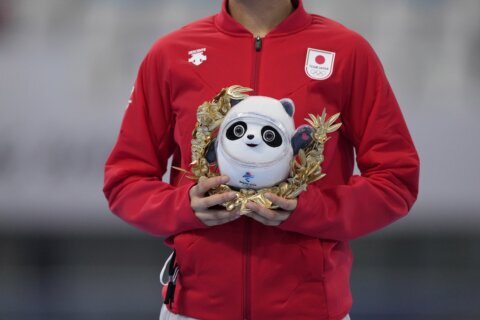 BEIJING SNAPSHOT: Olympic winners get plush panda then medal