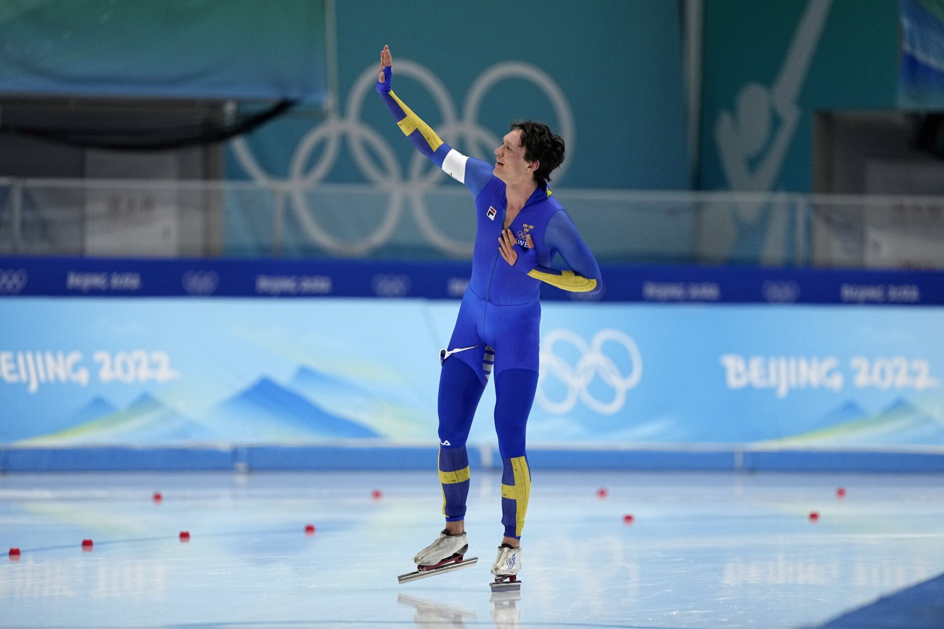 Nils van der Poel of Sweden reacts after breaking his own world record in the men's speedskating 10,000-meter race at the 2022 Winter Olympics, Friday, Feb. 11, 2022, in Beijing. (AP Photo/Ashley Landis)