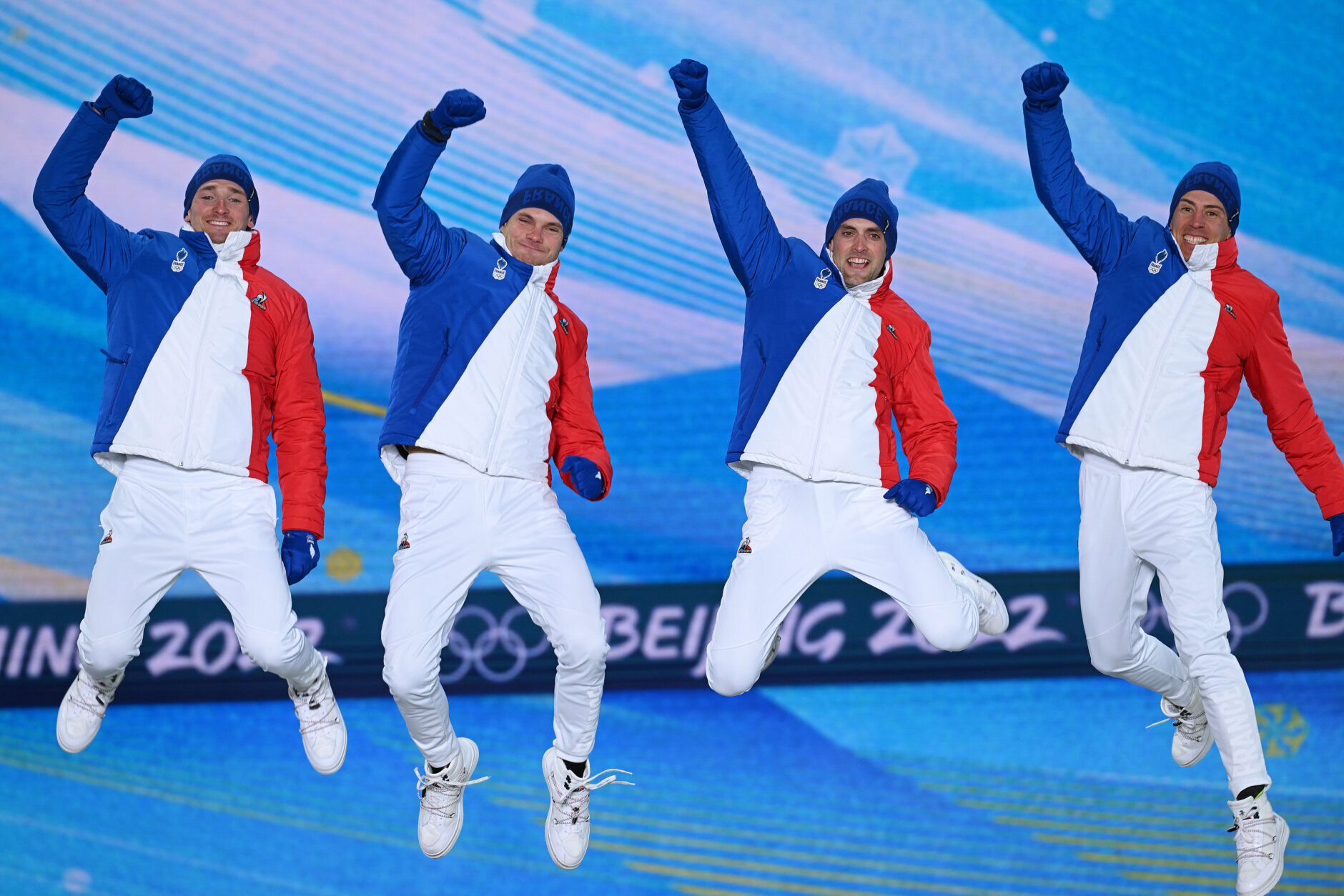 ZHANGJIAKOU, CHINA - FEBRUARY 16: Silver medallists Fabien Claude, Emilien Jacquelin, Simon Desthieux and Quentin Fillon Maillet of Team France celebrate during the Men's Biathlon 4x7.5km Relay medal ceremony on Day 12 of the Beijing 2022 Winter Olympic Games at Zhangjiakou Medal Plaza  on February 16, 2022 in Zhangjiakou, China.  (Photo by Matthias Hangst/Getty Images)