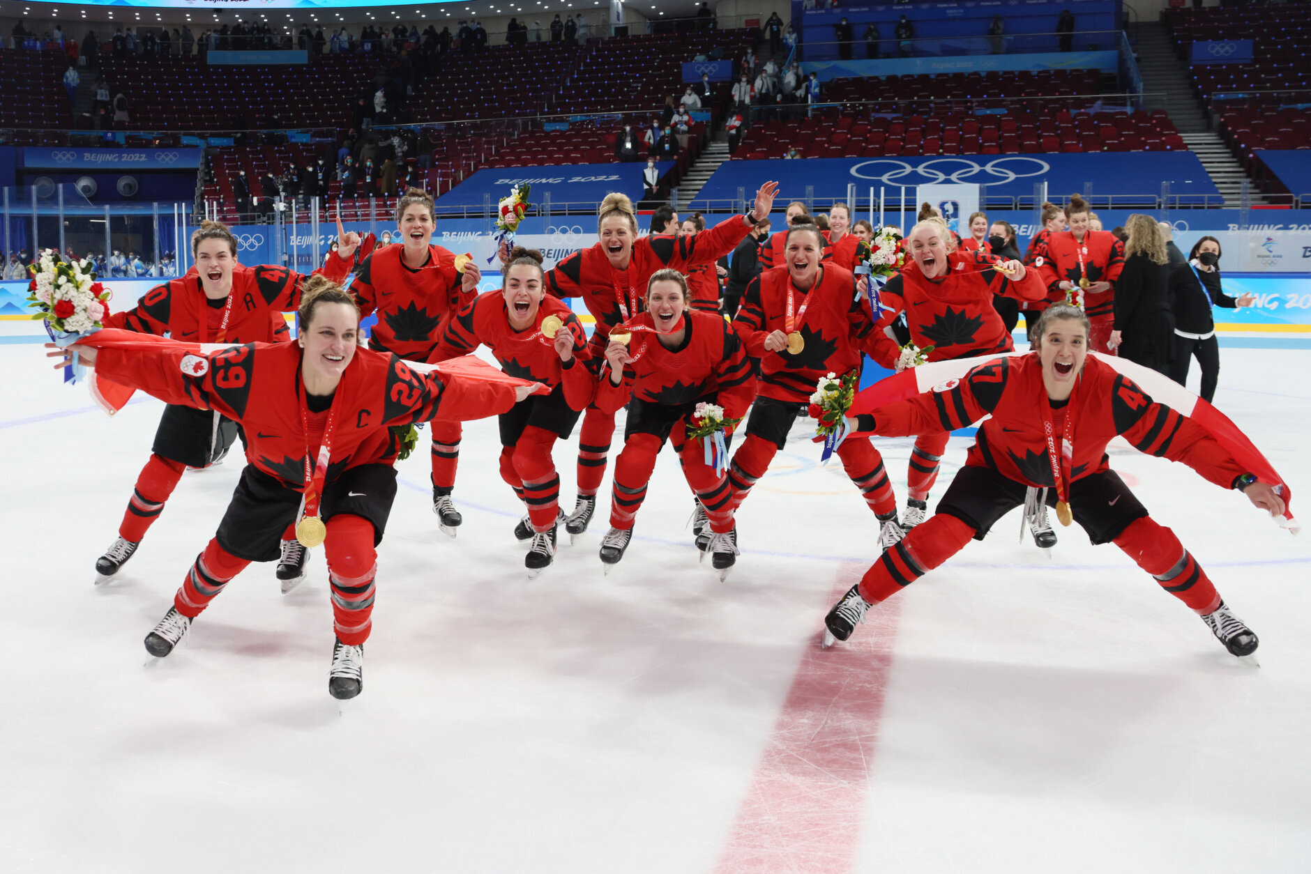 BEIJING, CHINA - FEBRUARY 17: Team Canada celebrates their gold medals after winning the Women's Ice Hockey Gold Medal match between Team Canada and Team United States on Day 13 of the Beijing 2022 Winter Olympic Games at Wukesong Sports Centre on February 17, 2022 in Beijing, China. (Photo by Bruce Bennett/Getty Images)