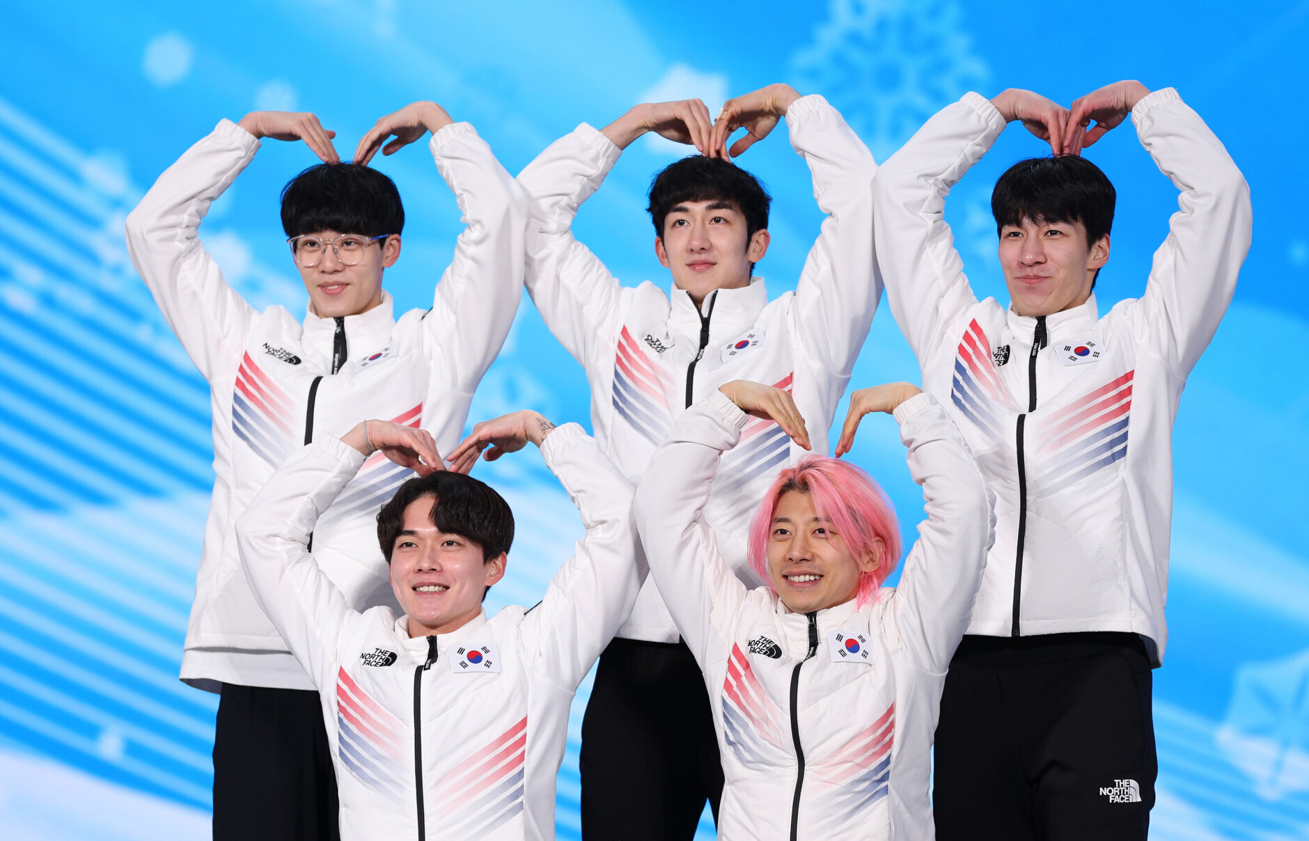 BEIJING, CHINA - FEBRUARY 17: Silver Medallists Juneseo Lee, Daeheon Hwang, Yoongy Kwak, Dongwook Kim and Janghyuk Park of Team South Korea celebrate during the Men's 5000m Relay medal ceremony on Day 13 of the Beijing 2022 Winter Olympics at Medal Plaza on February 17, 2022 in Beijing, China. (Photo by Sarah Stier/Getty Images)