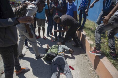 1 killed, 2 wounded as police clash with Haitian workers