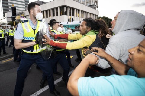 Protester drives at New Zealand police as cordon tightens