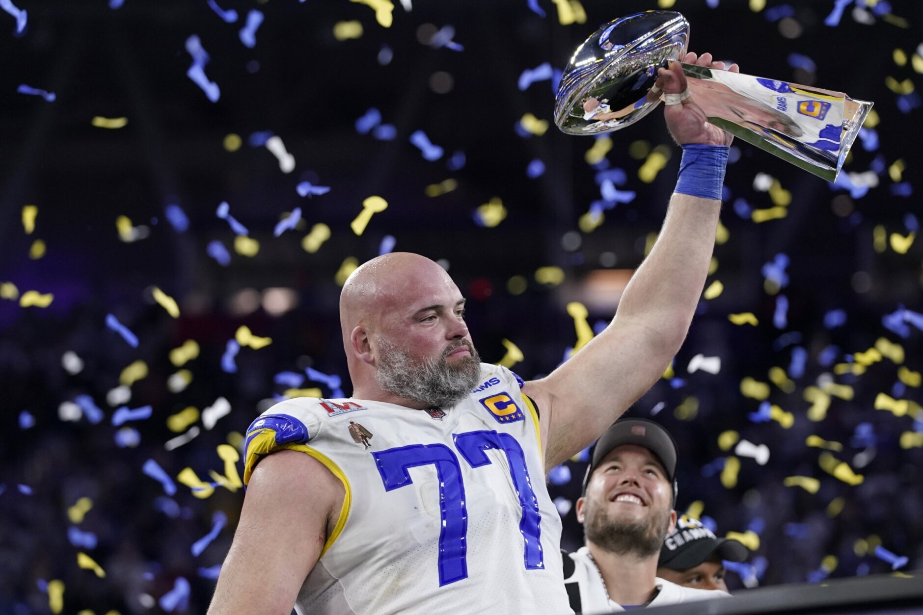 Los Angeles Rams offensive tackle Andrew Whitworth (77) holds up the Lombardi Trophy after the Rams defeated the Cincinnati Bengals in the NFL Super Bowl 56 football game Sunday, Feb. 13, 2022, in Inglewood, Calif. (AP Photo/Mark J. Terrill)