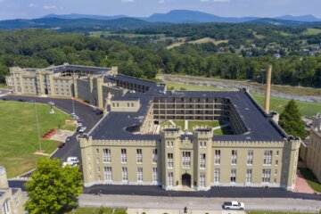 FILE - This July 15, 2020, file photo shows the barracks at Virginia Military Institute in Lexington, Va. The Virginia Military Institute will change its student-run honor court to make it more fair to cadets as part of a response to a state-ordered investigation into racism and sexism. The Washington Post reports VMI detailed the reforms in a progress report Friday, Feb. 4, 2022. (AP Photo/Steve Helber, File)