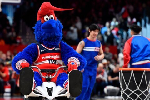 Wizards mascot G-Wiz visits local teacher who went viral for full-court shot