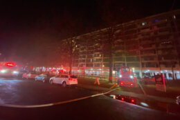 People living in a mid-rise apartment building awoke Tuesday, Feb. 22, 2022 to neighbors banging on their doors to get them out of the building where an apartment was on fire. (WTOP/John Domen)