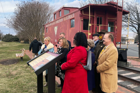 New sign at Herndon Caboose Park remembers racial segregation on the railroad