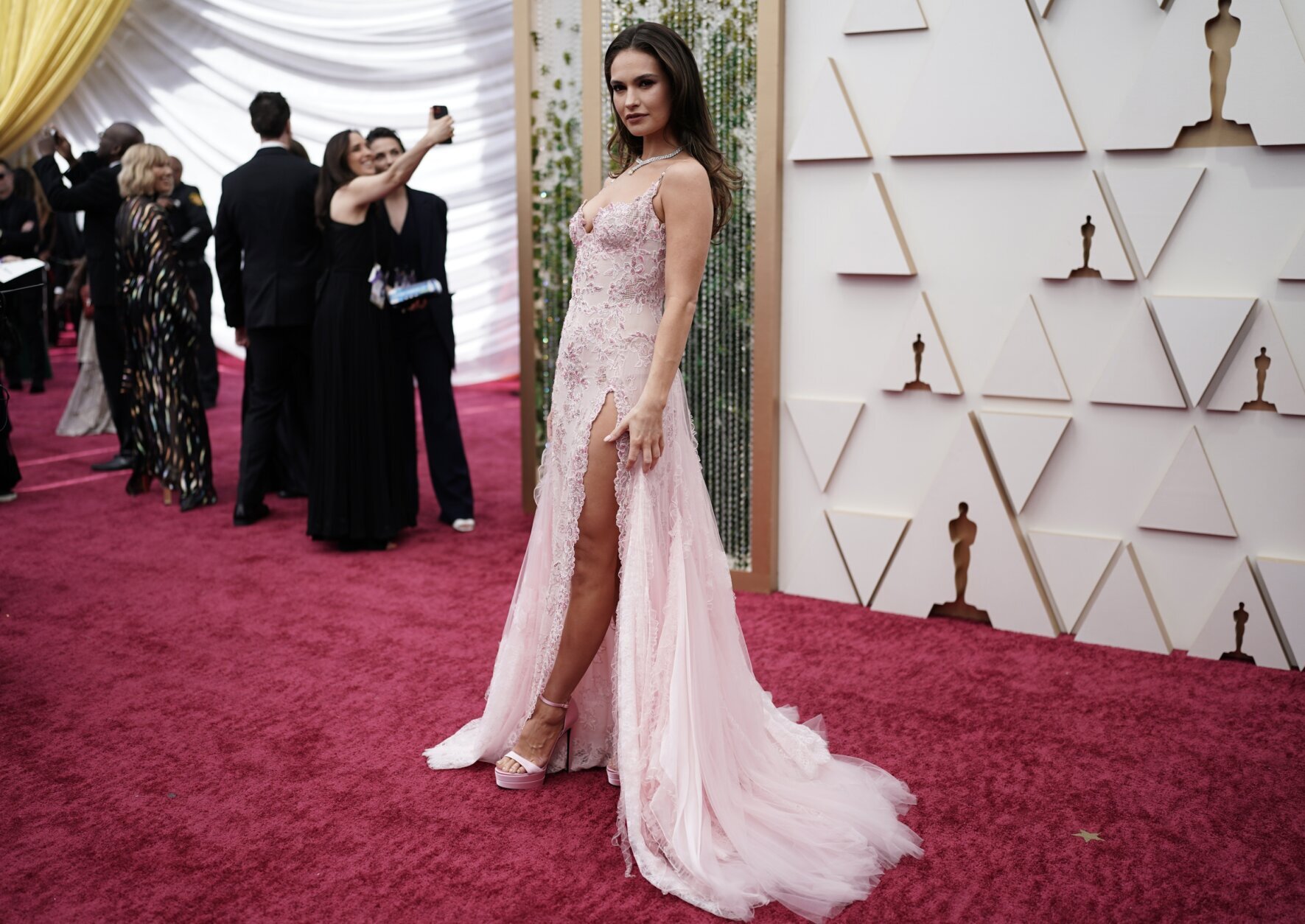 Lily James arrives at the Oscars on Sunday, March 27, 2022, at the Dolby Theatre in Los Angeles. (AP Photo/Jae C. Hong)