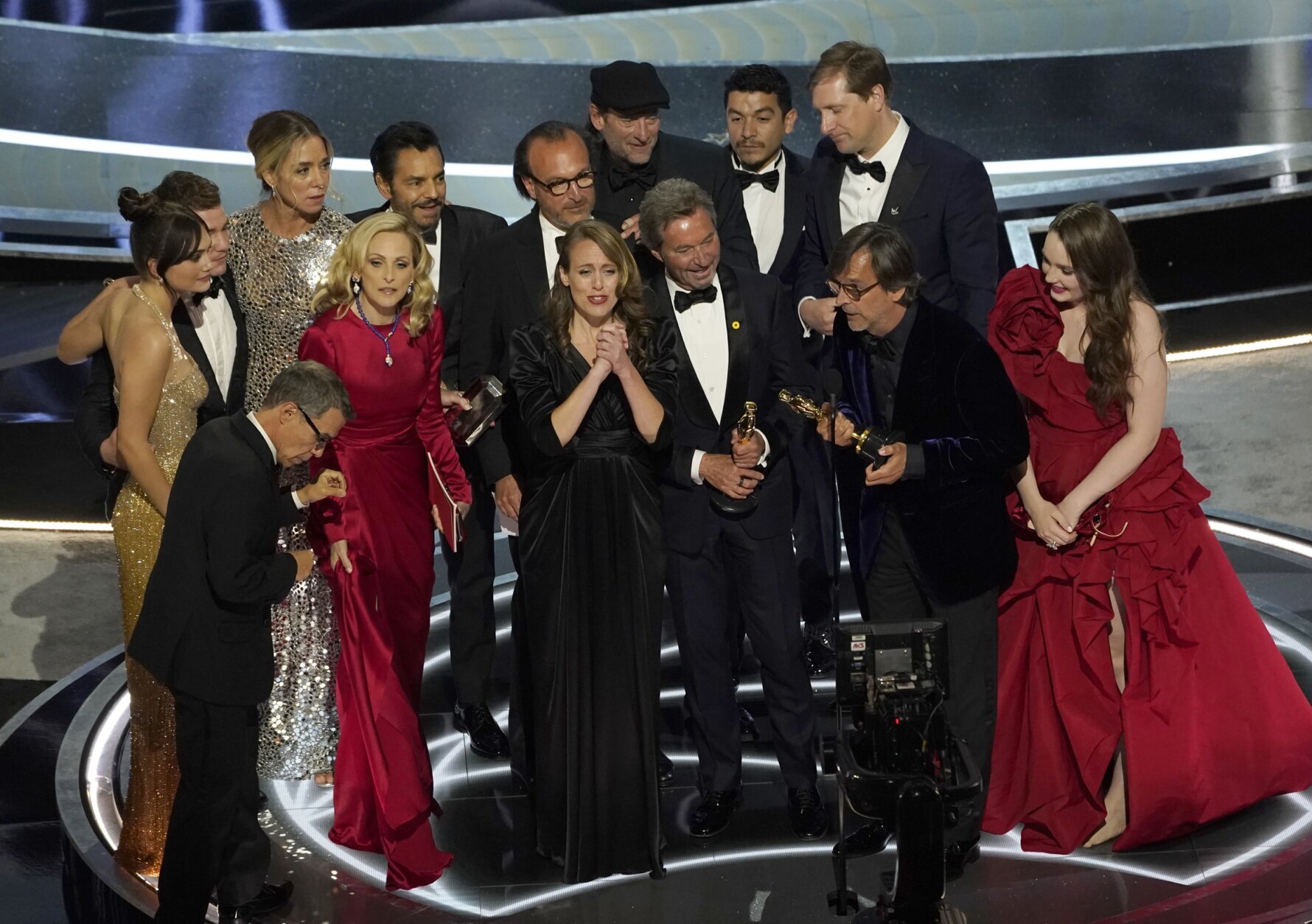 The cast and crew of "CODA" accept the award for best picture at the Oscars on Sunday, March 27, 2022, at the Dolby Theatre in Los Angeles. (AP Photo/Chris Pizzello)