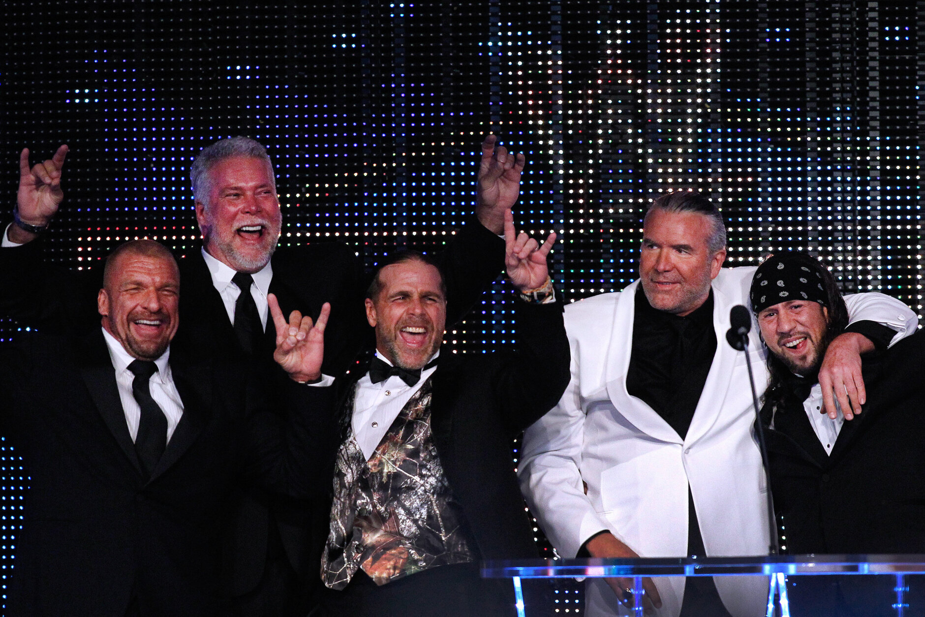 IMAGE DISTRIBUTED FOR WWE - From left to right, Paul Levesque aka Triple H, Kevin Nash, Michael Shawn Hickenbottom aka Shawn Michaels, 2014 inductee Scott Hall aka Razor Ramon, and Sean Waltman aka X-Pac, are seen at the WWE Hall of Fame Induction at the Smoothie King Center in New Orleans on Saturday, April 5, 2014. (Jonathan Bachman/AP Images for WWE)