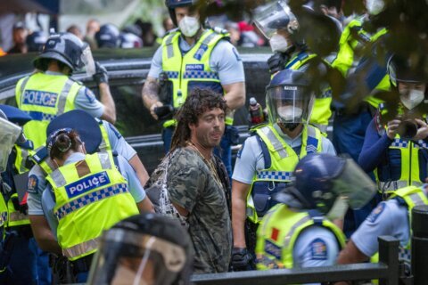 New Zealand protesters set fires as police break up camp