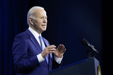 Biden signs budget bill with Ukraine aid but no virus cash