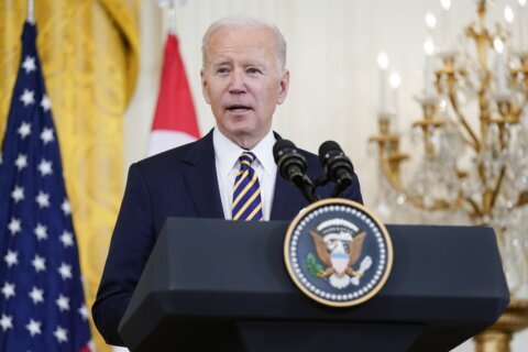 Biden receives 2nd booster, presses Congress on virus funds