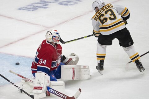 Marchand scores 2, lifts Bruins past Canadiens in OT