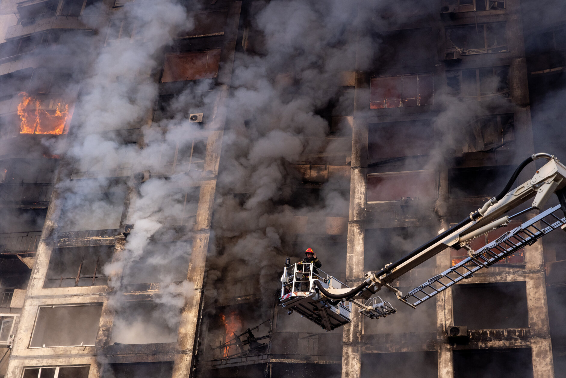 <p>Firefighters work to extinguish a fire at a residential apartment building after it was hit by a Russian attack in the early hours of the morning in the Sviatoshynskyi District on March 15, 2022 in Kyiv, Ukraine. Russian forces continue to attempt to encircle the Ukrainian capital, although they have faced stiff resistance and logistical challenges since launching a large-scale invasion of Ukraine last month. Russian troops are advancing from the northwest and northeast of the city.</p>
