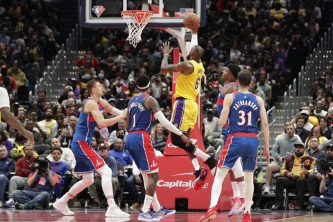 James passes Malone, but Lakers blow lead in loss to Wizards