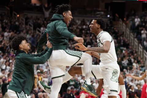 Izzo passes Knight as Michigan State holds off Maryland