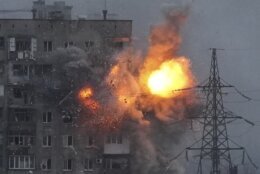 An explosion in an apartment building that came under fire from a Russian army tank in Mariupol, Ukraine, Friday, March 11, 2022. Ukraine’s military says Russian forces have captured the eastern outskirts of the besieged city of Mariupol. In a Facebook update Saturday, the military said the capture of Mariupol and Severodonetsk in the east were a priority for Russian forces. Mariupol has been under siege for over a week, with no electricity, gas or water. (AP Photo/Evgeniy Maloletka)