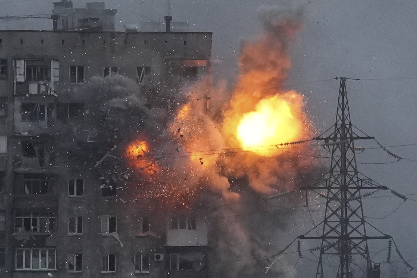 An explosion in an apartment building that came under fire from a Russian army tank in Mariupol, Ukraine, Friday, March 11, 2022. Ukraine’s military says Russian forces have captured the eastern outskirts of the besieged city of Mariupol. In a Facebook update Saturday, the military said the capture of Mariupol and Severodonetsk in the east were a priority for Russian forces. Mariupol has been under siege for over a week, with no electricity, gas or water. (AP Photo/Evgeniy Maloletka)