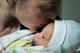 Kateryna Suharokova kisses her newborn son Makar in the basement of a maternity hospital converted into a medical ward and used as a bomb shelter in Mariupol, Ukraine, Monday, Feb. 28, 2022. (AP Photo/Evgeniy Maloletka)