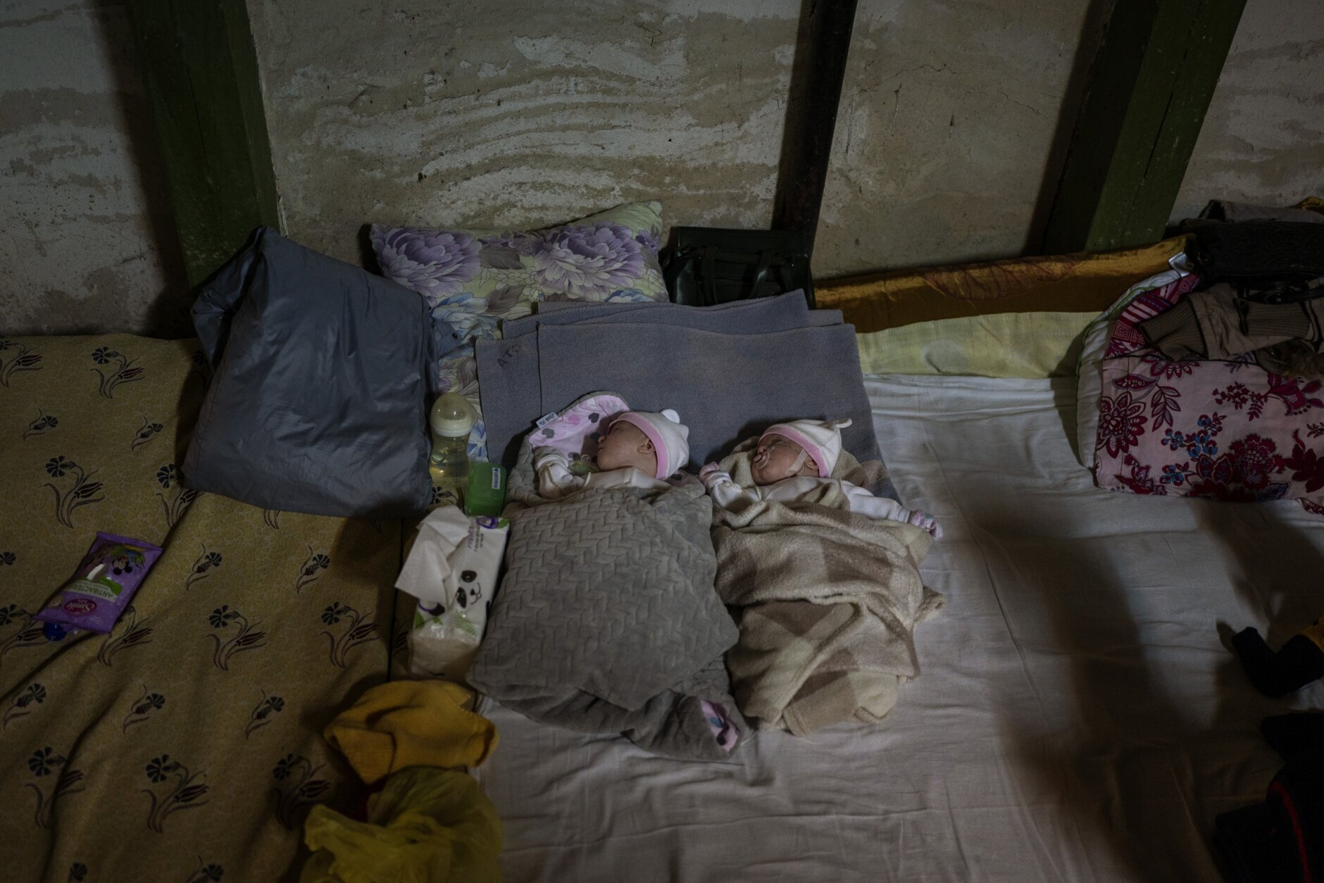 Newborn twin brothers sleep in a basement used as a bomb shelter at the Okhmadet children's hospital in central Kyiv, Ukraine, Monday, Feb. 28, 2022. (AP Photo/Emilio Morenatti)