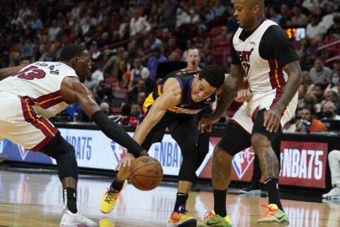 Booker has 23 points in return, Suns roll past Heat 111-90