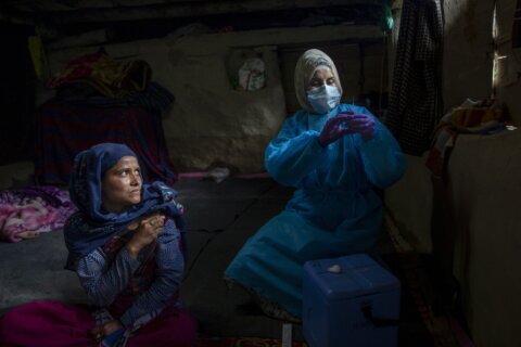 AP PHOTOS: 2 years of images tell the story of the pandemic