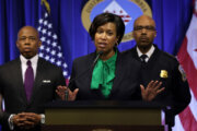 WASHINGTON, DC - MARCH 14:  Washington, DC Mayor Muriel Bowser speaks as Washington Metropolitan Police Chief Robert Contee III (R) and New York City Mayor Eric Adams look on at a news conference at the John Wilson Building March 14, 2022 in Washington, DC. The DC and New York police departments are asking the public for help in identifying an individual who is wanted for multiple shootings of the homelessness in both cities. (Photo by Alex Wong/Getty Images)
