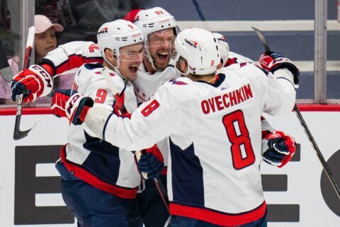Capitals rally late, beat Canucks 4-3 in overtime