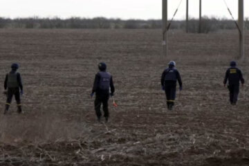 Ukrainian deminers check for unexploded devices