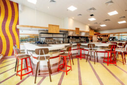 The bar area revives the Waffle Shop’s M-shaped laminate counter with bar stools. (Courtesy KnowPR)