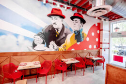 A second dining room has hand-painted murals by local artist Red Swan of Italian film stars. (Courtesy KnowPR)