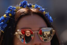 People attend a pro-Ukrainian protest under the slogan "March for true Peace in Ukraine", in Berlin, Germany, Saturday, April 16, 2022. (AP Photo/Hannibal Hanschke)
