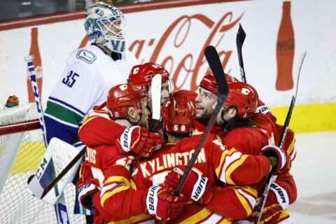 Dube scores 2, Lindholm gets 40th as Flames beat Canucks 6-3