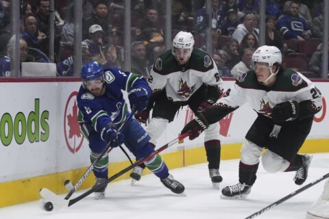 Vancouver keeps playoff hopes alive with 7-1 rout of Arizona